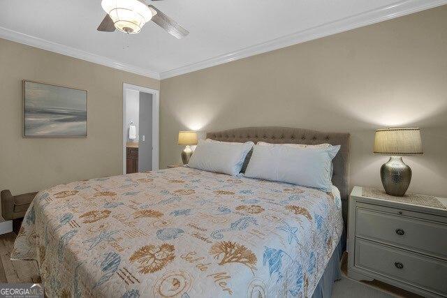 2508 Demere Rd Unit 2, Saint Simons, GA 31522 - bedroom with ornamental molding and ceiling fan