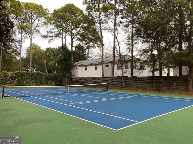 2508 Demere Rd Unit 2, Saint Simons, GA 31522 - view of sport court featuring basketball court and fence