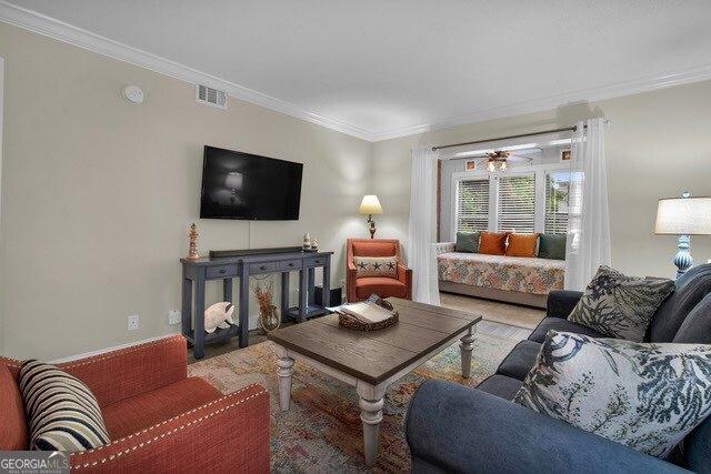 2508 Demere Rd Unit 2, Saint Simons, GA 31522 - living area with crown molding and visible vents