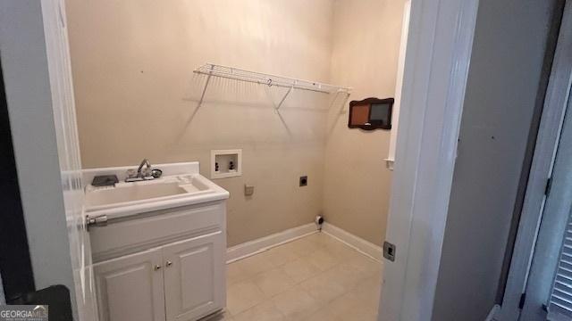 169 Cambridge Way, Macon, GA 31220 - laundry area with washer hookup, hookup for an electric dryer, baseboards, cabinet space, and light tile patterned flooring