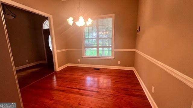169 Cambridge Way, Macon, GA 31220 - unfurnished room featuring a chandelier, wood finished floors, and baseboards