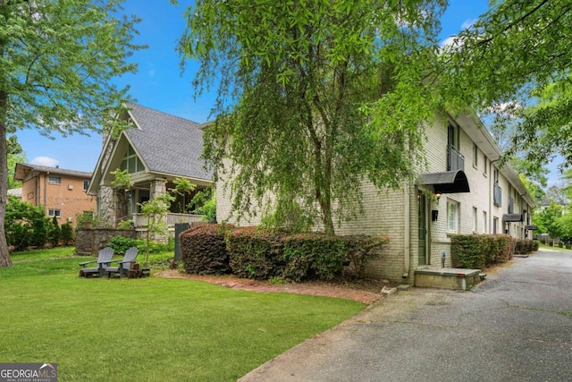 798 Saint Charles Ave NE Unit 7, Atlanta, GA 30306 - view of home's exterior with brick siding and a lawn