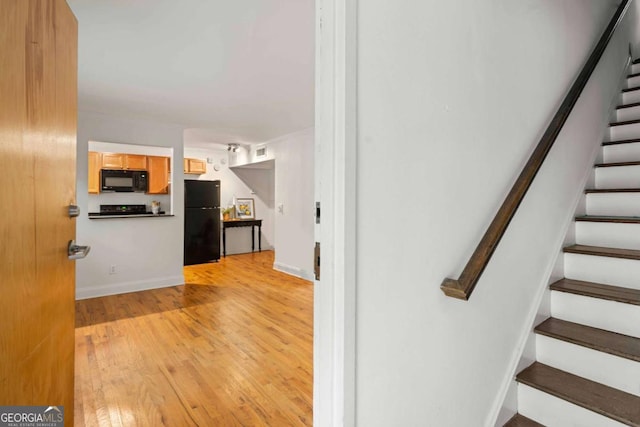 798 Saint Charles Ave NE Unit 7, Atlanta, GA 30306 - stairs featuring visible vents and wood finished floors