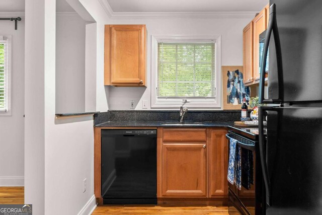 798 Saint Charles Ave NE Unit 7, Atlanta, GA 30306 - kitchen featuring crown molding, black appliances, a sink, and plenty of natural light