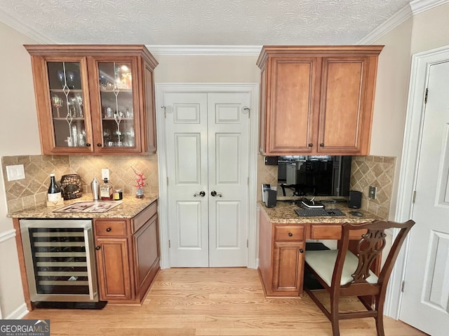 4614 Capers Xing W, Peachtree Corners, GA 30092 - bar featuring decorative backsplash, a dry bar, light wood-type flooring, wine cooler, and ornamental molding
