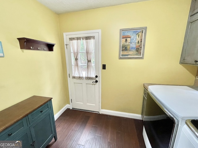 4614 Capers Xing W, Peachtree Corners, GA 30092 - clothes washing area featuring cabinet space, baseboards, washer and clothes dryer, and dark wood-type flooring