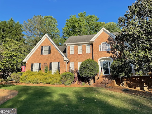 4614 Capers Xing W, Peachtree Corners, GA 30092 - colonial-style house with brick siding and a front yard