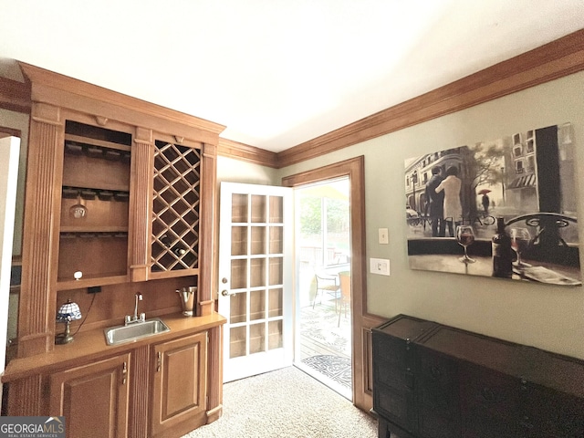 4614 Capers Xing W, Peachtree Corners, GA 30092 - wine area with indoor wet bar, crown molding, light carpet, and a sink