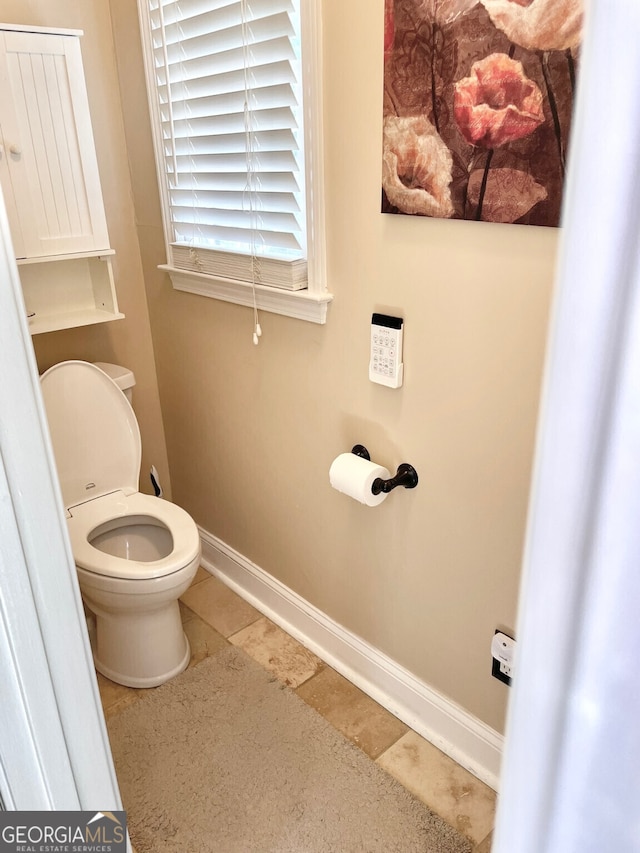 4614 Capers Xing W, Peachtree Corners, GA 30092 - bathroom featuring toilet, baseboards, and tile patterned flooring
