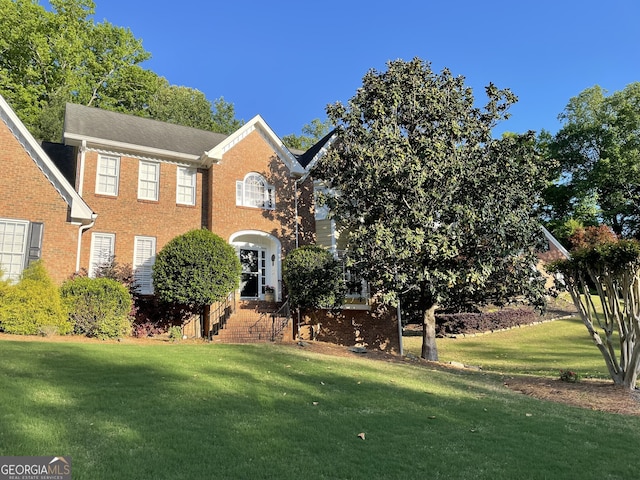 4614 Capers Xing W, Peachtree Corners, GA 30092 - view of front of house featuring brick siding and a front lawn