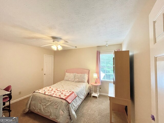 4614 Capers Xing W, Peachtree Corners, GA 30092 - bedroom with baseboards, a ceiling fan, carpet flooring, and a textured ceiling