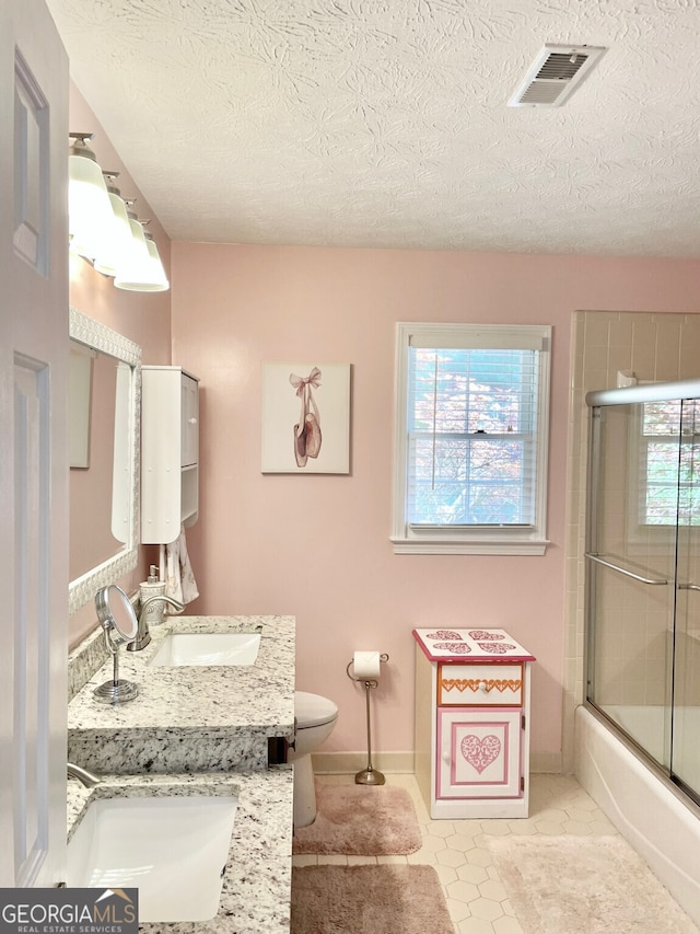 4614 Capers Xing W, Peachtree Corners, GA 30092 - bathroom with vanity, toilet, a textured ceiling, baseboards, and visible vents