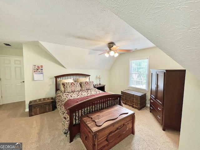 4614 Capers Xing W, Peachtree Corners, GA 30092 - bedroom featuring visible vents, a textured ceiling, lofted ceiling, and light carpet
