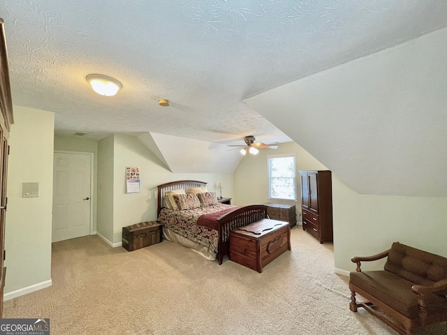 4614 Capers Xing W, Peachtree Corners, GA 30092 - bedroom featuring baseboards, light carpet, a textured ceiling, and lofted ceiling