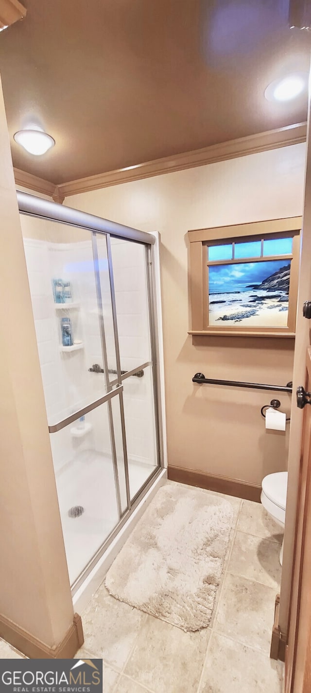 4614 Capers Xing W, Peachtree Corners, GA 30092 - bathroom featuring baseboards, ornamental molding, and a stall shower