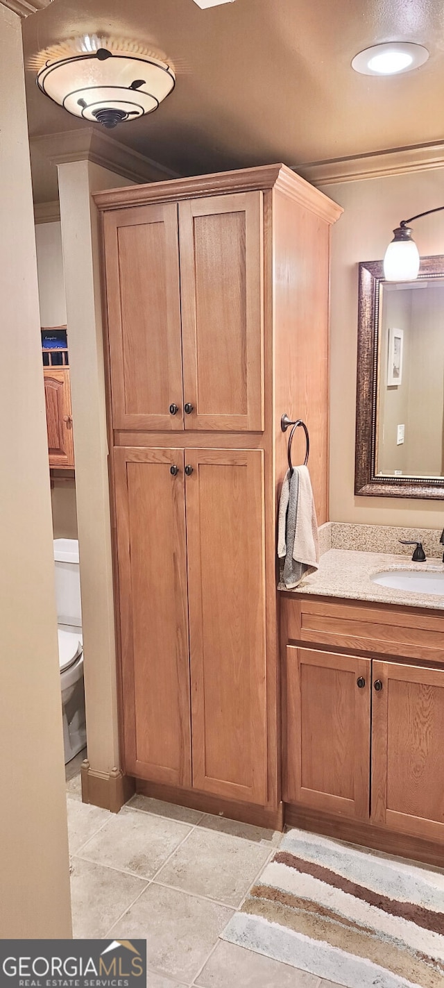 4614 Capers Xing W, Peachtree Corners, GA 30092 - bathroom featuring vanity, ornamental molding, and toilet
