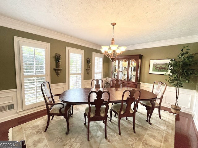 4614 Capers Xing W, Peachtree Corners, GA 30092 - dining space with wainscoting, wood finished floors, and a chandelier