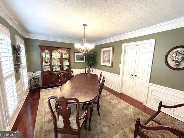 4614 Capers Xing W, Peachtree Corners, GA 30092 - dining space with crown molding, plenty of natural light, and wainscoting