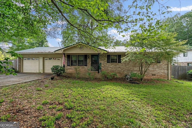 ranch-style house with driveway, a front yard, fence, brick siding, and a garage
