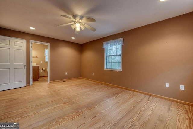 unfurnished bedroom with light wood finished floors, recessed lighting, a ceiling fan, baseboards, and ensuite bathroom