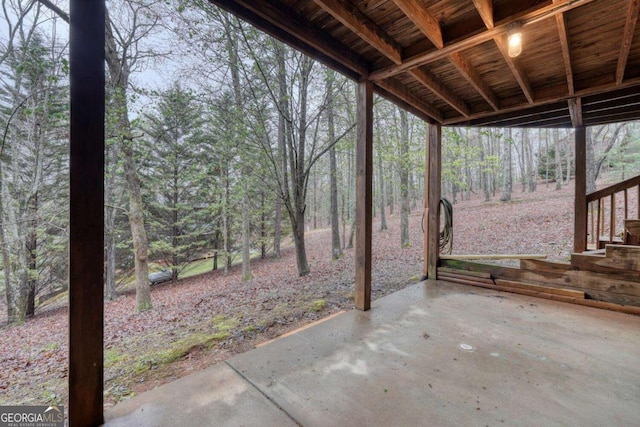 view of patio featuring a wooded view