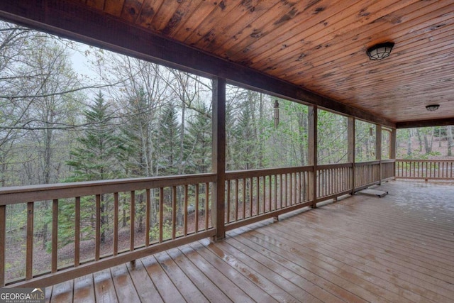 wooden terrace with a forest view