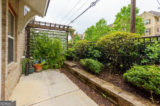 569 Mirrormont Dr SE, Smyrna, GA 30080 - fenced backyard with a patio area