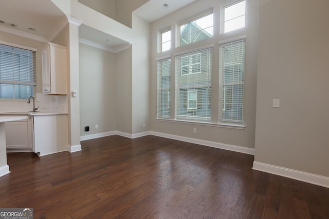 569 Mirrormont Dr SE, Smyrna, GA 30080 - unfurnished dining area with ornamental molding and dark wood finished floors