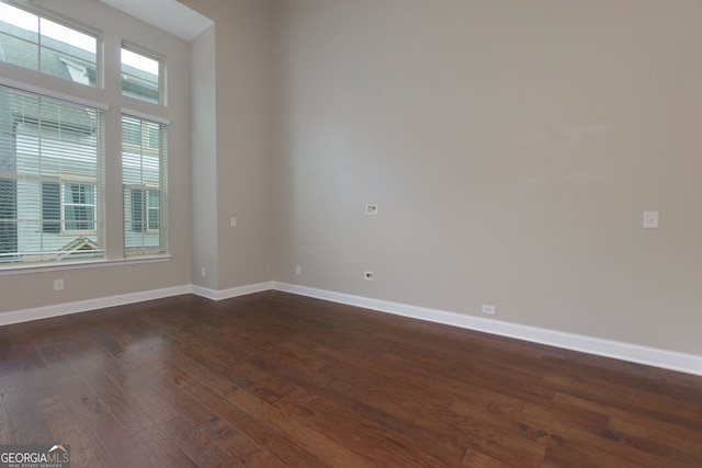 569 Mirrormont Dr SE, Smyrna, GA 30080 - unfurnished room with dark wood-type flooring and baseboards