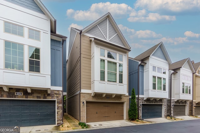 569 Mirrormont Dr SE, Smyrna, GA 30080 - multi unit property with a garage, stone siding, and board and batten siding