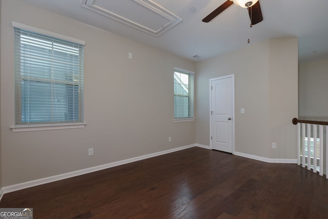 569 Mirrormont Dr SE, Smyrna, GA 30080 - spare room featuring ceiling fan, wood finished floors, and attic access