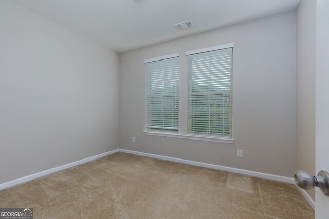 569 Mirrormont Dr SE, Smyrna, GA 30080 - carpeted spare room featuring baseboards