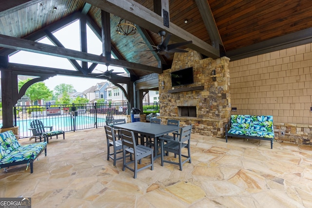 569 Mirrormont Dr SE, Smyrna, GA 30080 - view of patio / terrace featuring a gazebo, ceiling fan, an outdoor stone fireplace, and outdoor dining area