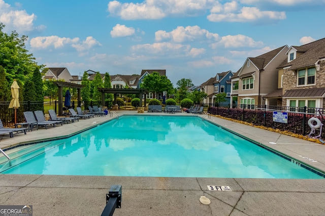 569 Mirrormont Dr SE, Smyrna, GA 30080 - community pool featuring a residential view, a pergola, and a patio