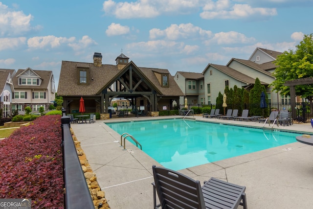 569 Mirrormont Dr SE, Smyrna, GA 30080 - community pool with a patio area and a residential view