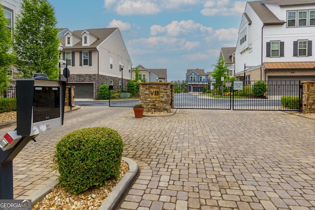 569 Mirrormont Dr SE, Smyrna, GA 30080 - view of street featuring a residential view, a gated entry, a gate, and curbs