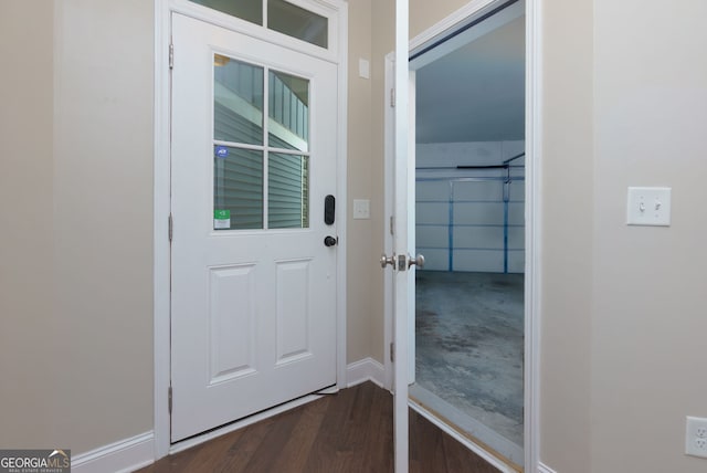 569 Mirrormont Dr SE, Smyrna, GA 30080 - doorway with dark wood-style floors and baseboards