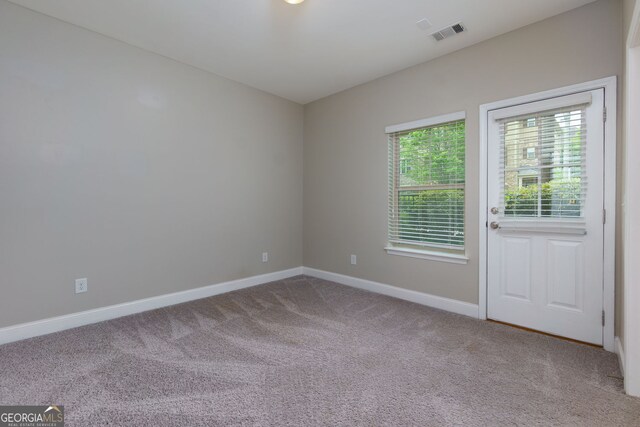 569 Mirrormont Dr SE, Smyrna, GA 30080 - empty room with carpet flooring and baseboards