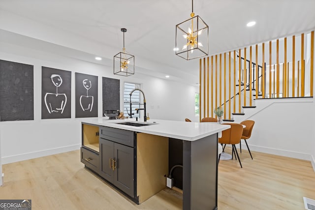 906 Mcdaniel St, Atlanta, GA 30310 - kitchen with a sink, light wood-type flooring, recessed lighting, hanging light fixtures, and light countertops