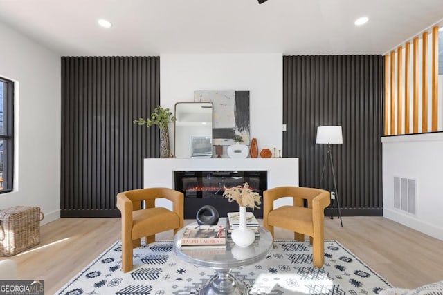 dining room featuring baseboards, visible vents, and wood finished floors