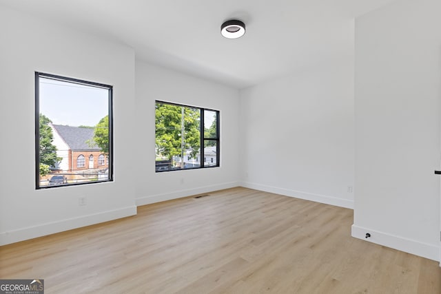 906 Mcdaniel St, Atlanta, GA 30310 - empty room with light wood finished floors and baseboards
