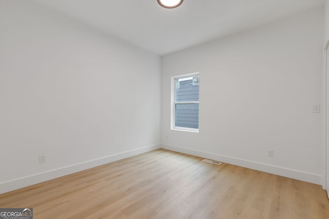 906 Mcdaniel St, Atlanta, GA 30310 - spare room featuring baseboards and light wood-type flooring