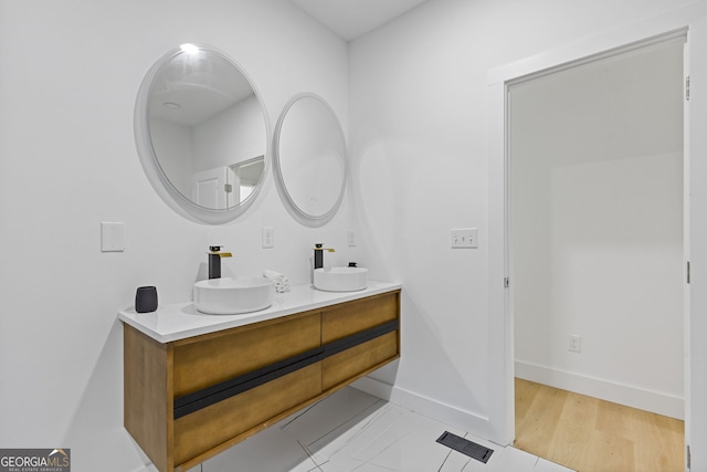 906 Mcdaniel St, Atlanta, GA 30310 - bathroom featuring double vanity and baseboards