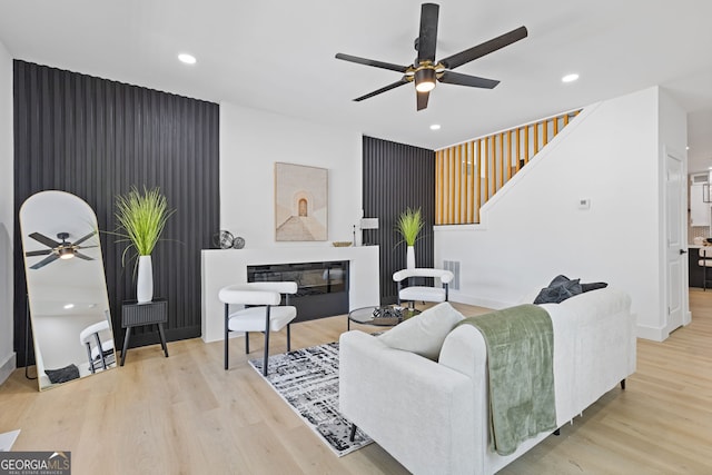 906 Mcdaniel St, Atlanta, GA 30310 - living room with a ceiling fan, recessed lighting, wood finished floors, stairway, and a glass covered fireplace