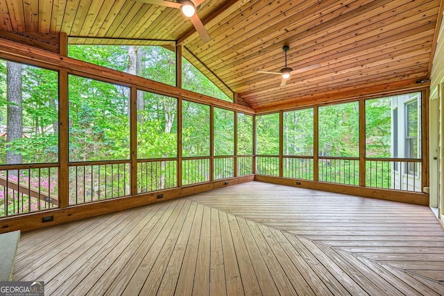unfurnished sunroom featuring ceiling fan