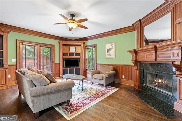 100 Barnard Pl, Atlanta, GA 30328 - living room with a wainscoted wall, ornamental molding, a fireplace, wood finished floors, and a ceiling fan