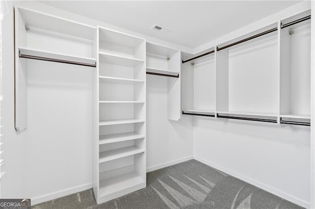 100 Barnard Pl, Atlanta, GA 30328 - walk in closet featuring visible vents and dark carpet