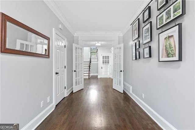 100 Barnard Pl, Atlanta, GA 30328 - hallway featuring dark wood finished floors, ornamental molding, baseboards, visible vents, and french doors