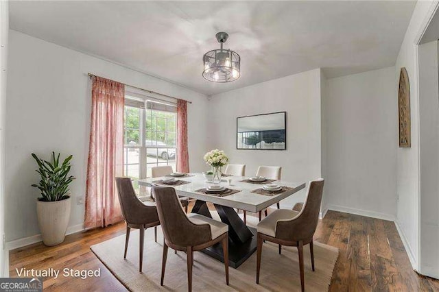 460 Broad St, Tallapoosa, GA 30176 - dining space with wood finished floors and a chandelier