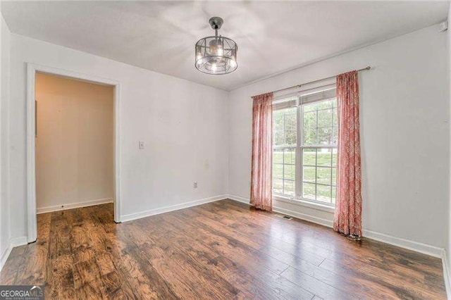 460 Broad St, Tallapoosa, GA 30176 - empty room featuring wood finished floors and baseboards